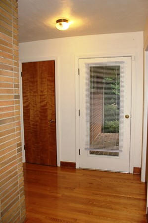1731 Rutrough Road Southeast Roanoke, VA 24014 - Photo 10 of 34 an empty room with wooden floor and windows