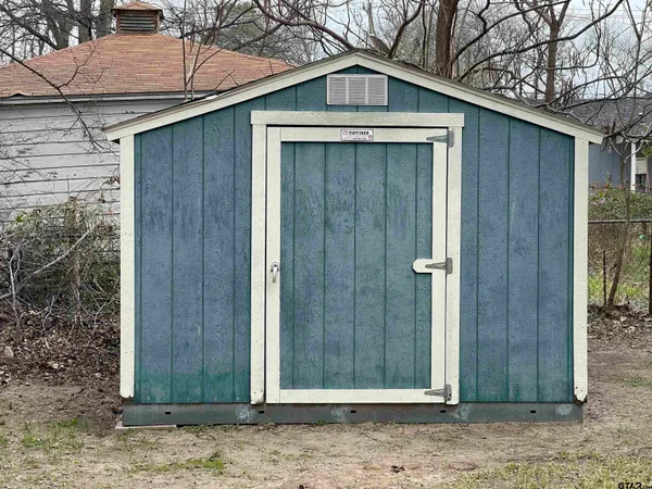 a front view of a house with a wooden fence