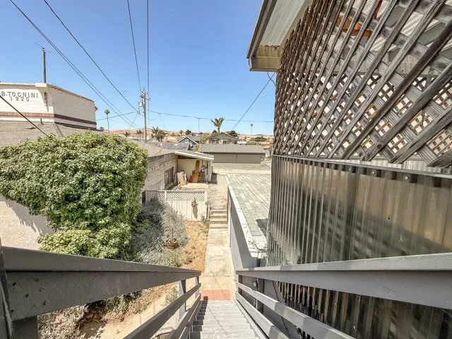 a view of balcony with furniture
