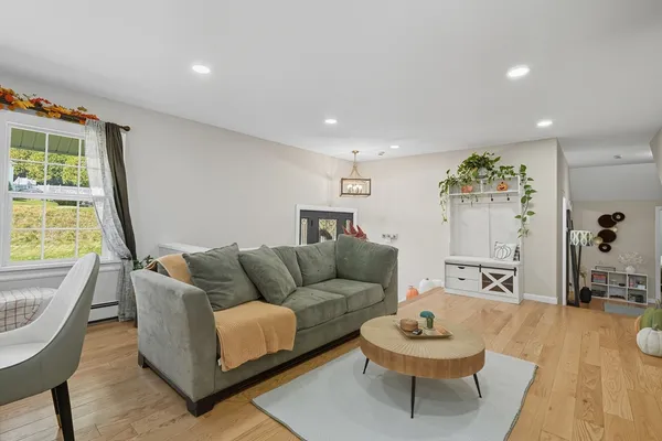 a living room with furniture and a large window