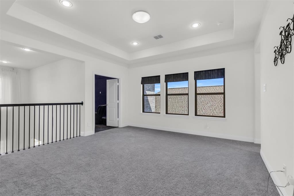 3511 Solaro Lane Rockwall, TX 75087 - Photo 22 of 40 a view of an empty room with windows