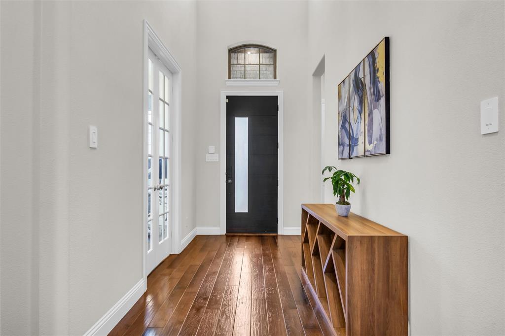 3511 Solaro Lane Rockwall, TX 75087 - Photo 4 of 40 a view of hallway with wooden floor