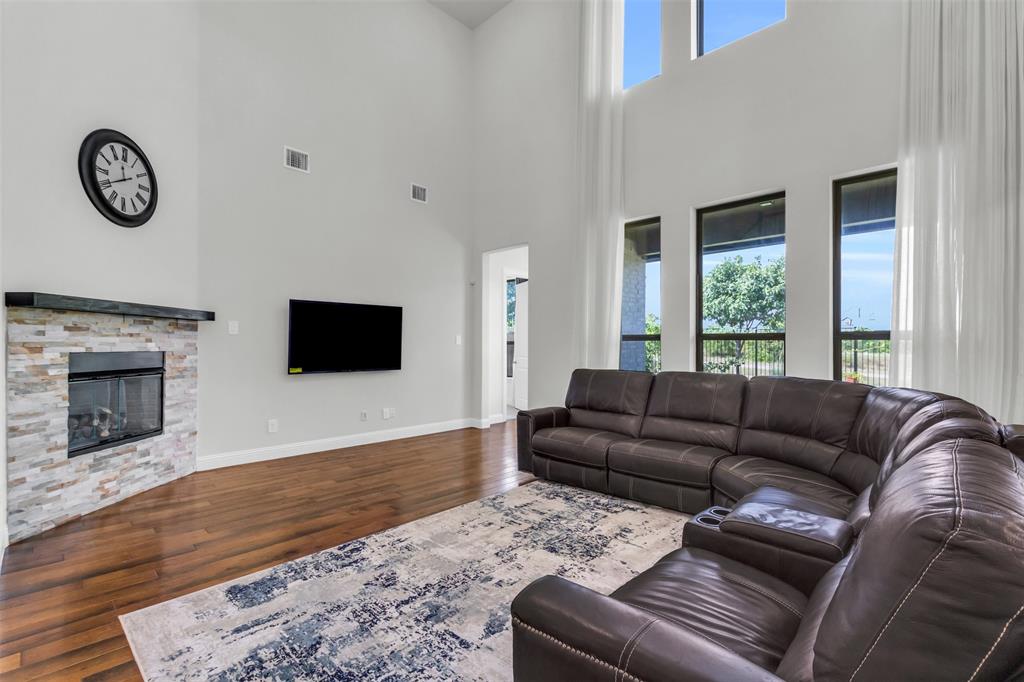 3511 Solaro Lane Rockwall, TX 75087 - Photo 7 of 40 a living room with furniture and a fireplace