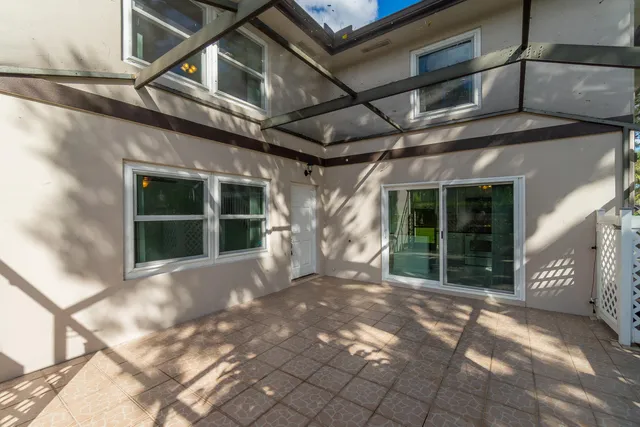 a kitchen with a refrigerator a stove a microwave a sink a window and cabinetry