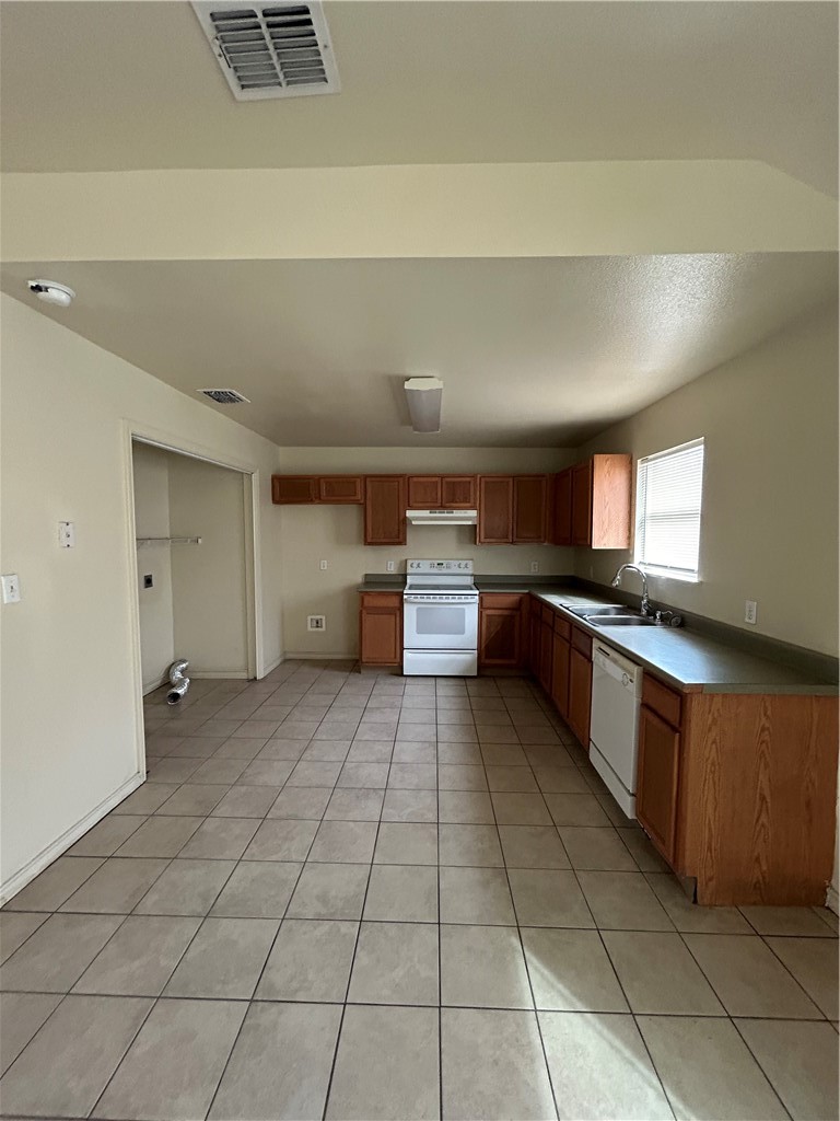 1401 Dewitt Street Corpus Christi, TX 78418 - Photo 3 of 11 a large kitchen with a stove