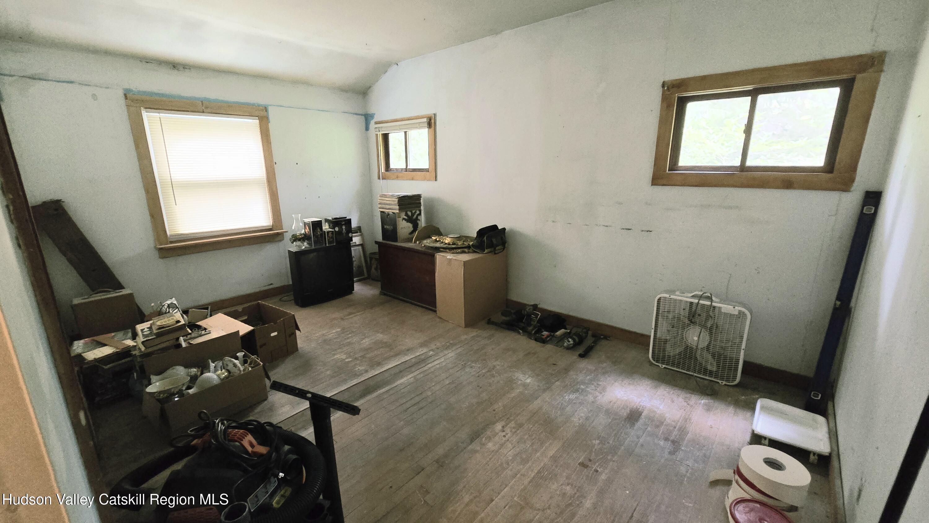 767 Rock City Road Chatham, NY 12136 - Photo 13 of 22 a room with furniture and a window