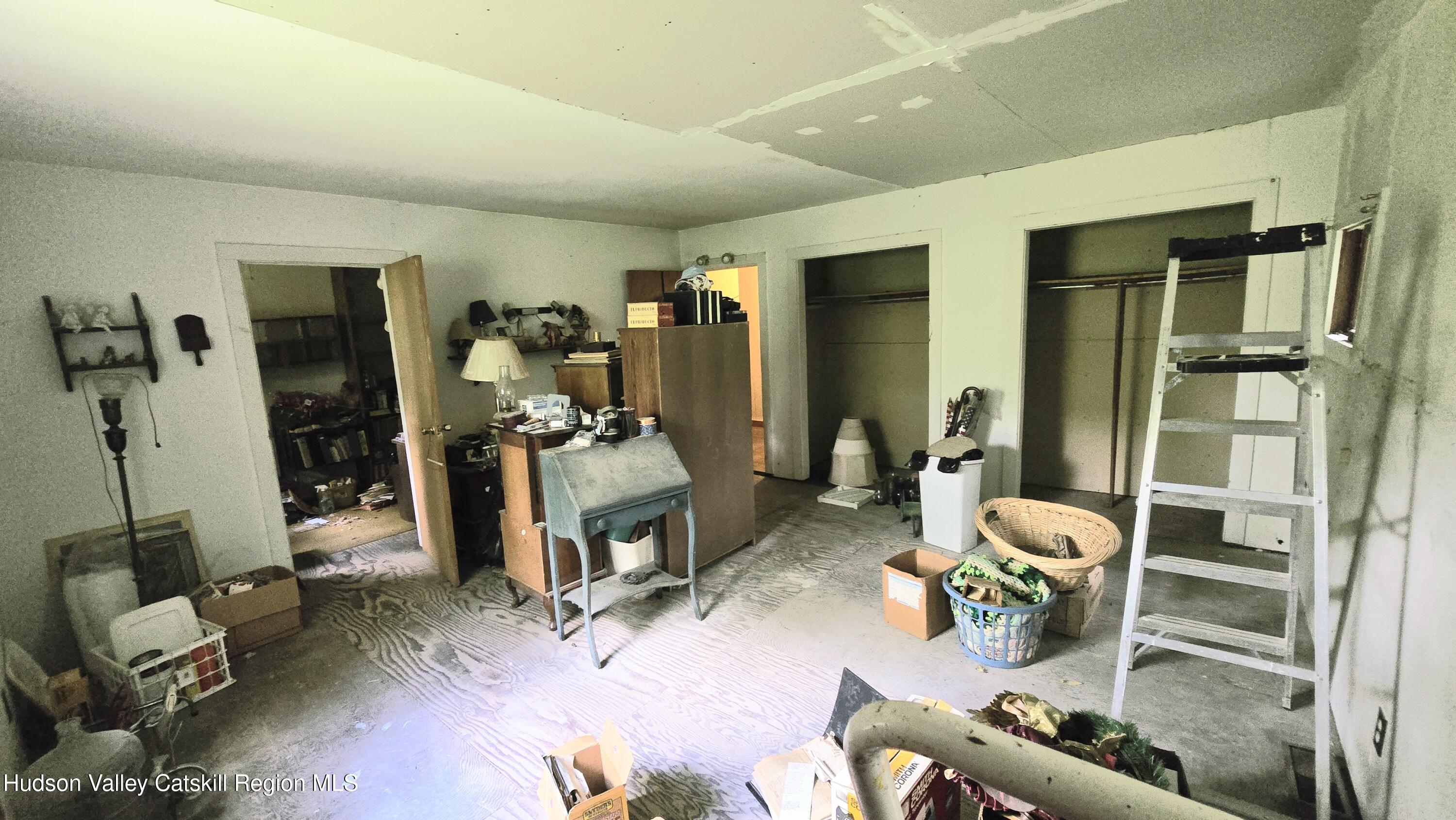 767 Rock City Road Chatham, NY 12136 - Photo 14 of 22 a room with furniture a mirror and gym equipment