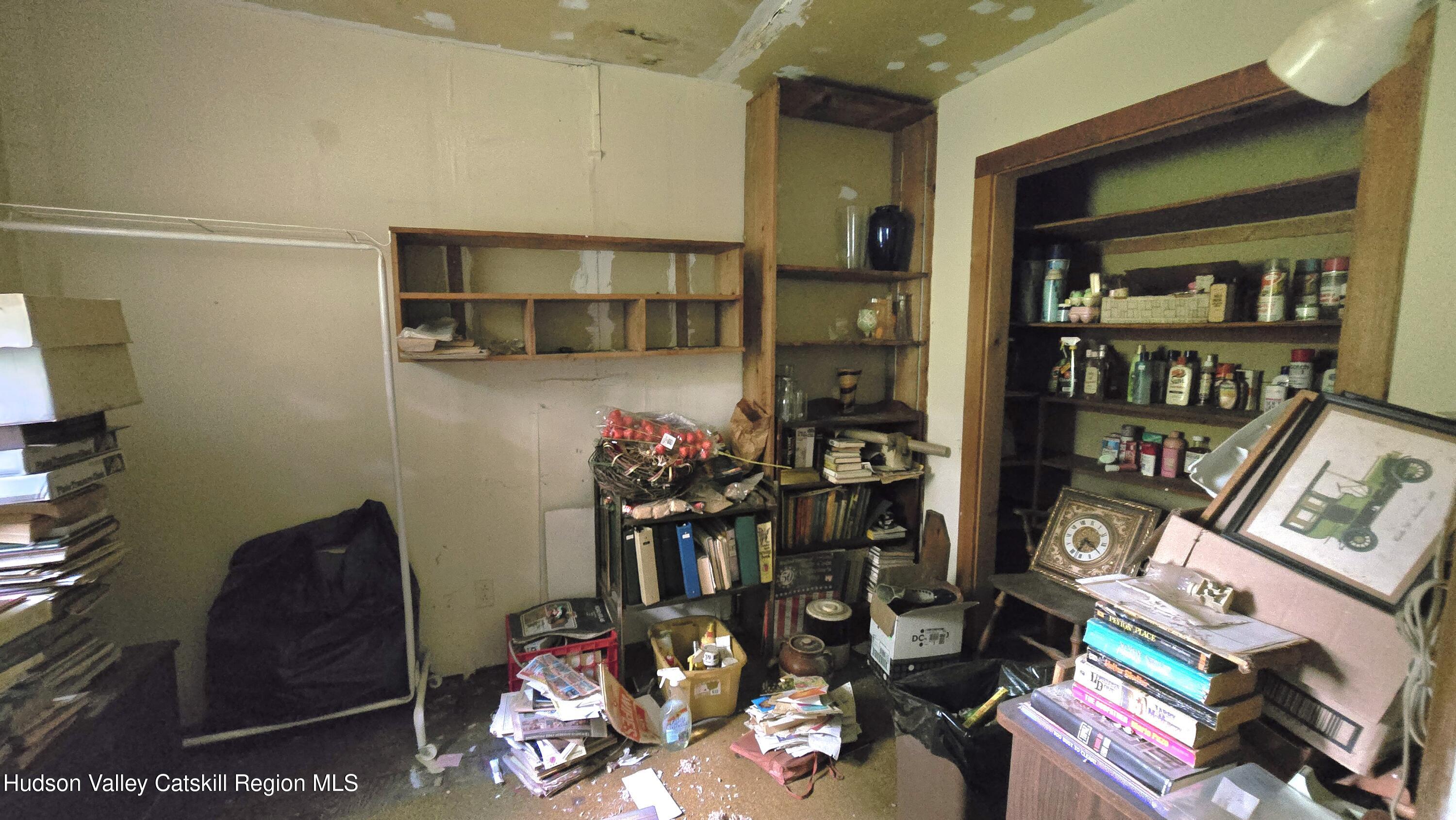 767 Rock City Road Chatham, NY 12136 - Photo 16 of 22 a living room with lots of furniture and white walls