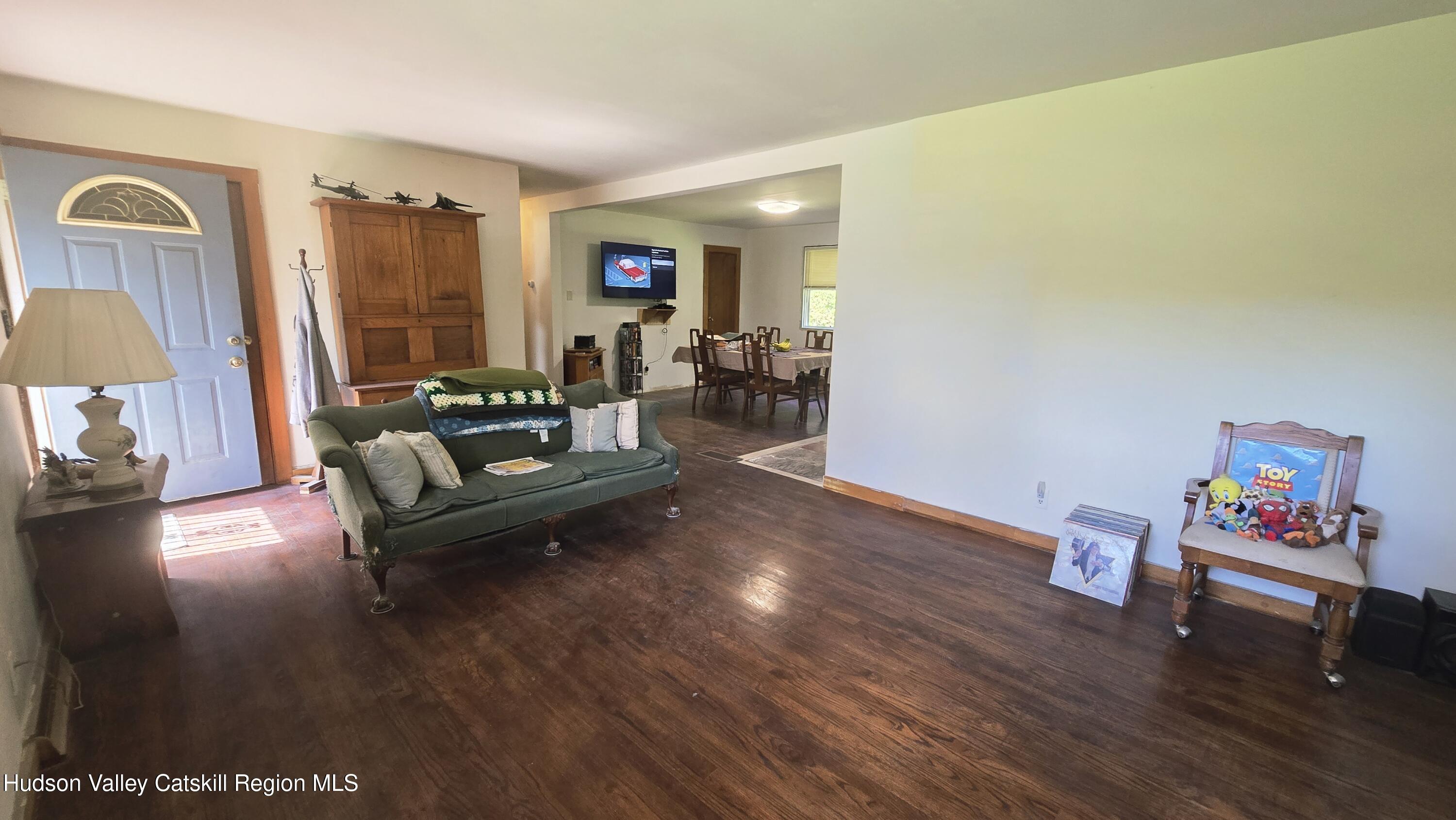 767 Rock City Road Chatham, NY 12136 - Photo 8 of 22 a living room with furniture and a wooden floor
