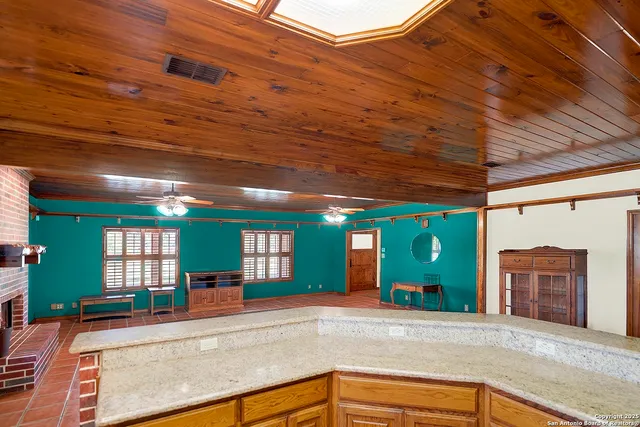 a view of a hallway with a livingroom