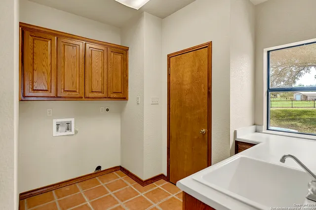 a view of a room that has a bed and a window