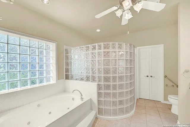 a bathroom with a bathtub and a shower