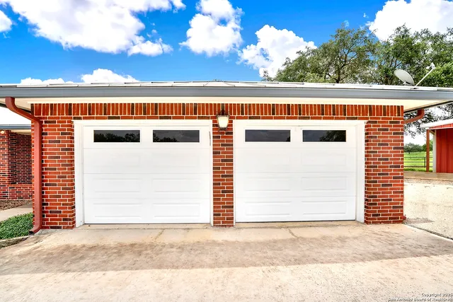 a view of front door and small yard