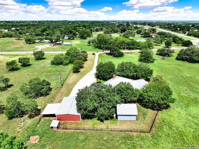 a view of a garden with a building