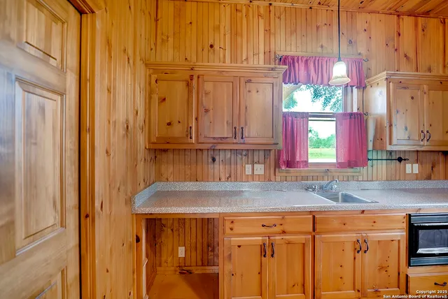 a kitchen with stainless steel appliances granite countertop a cabinets and a sink