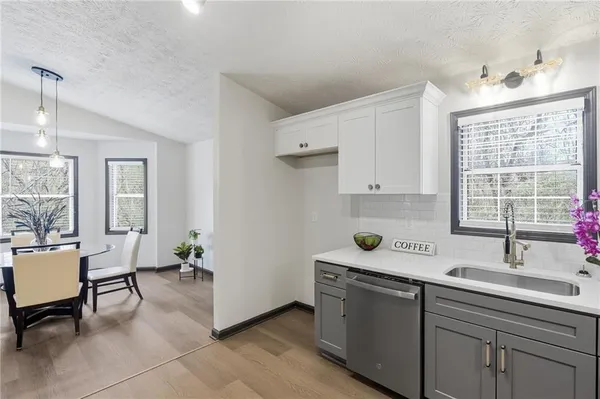 a kitchen with a sink and a window