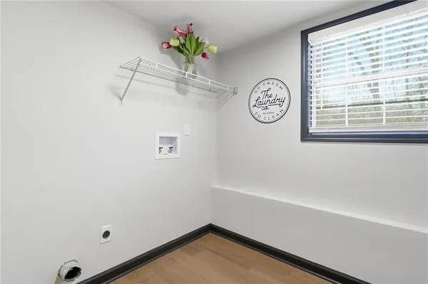 a bathroom with a shower and a window