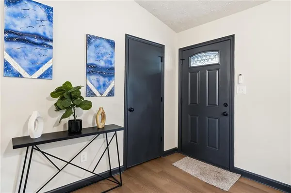 a view of a hallway with a potted plant