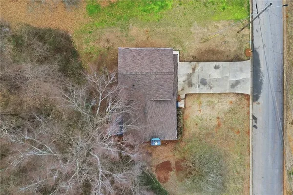 an aerial view of houses with yard