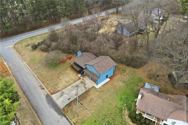 a view of a house with wooden fence and windows