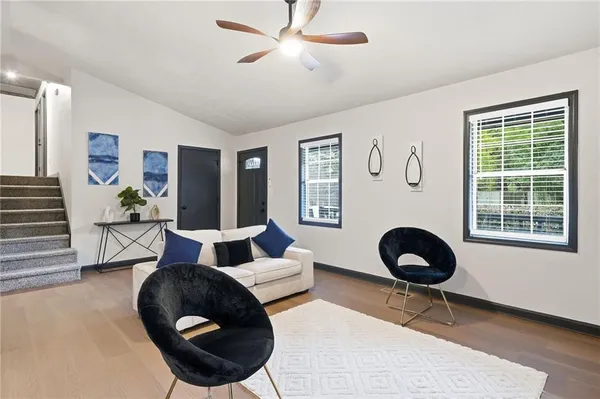 a living room with furniture and a rug