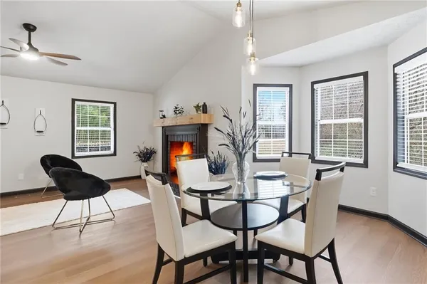 a dining room with furniture and window