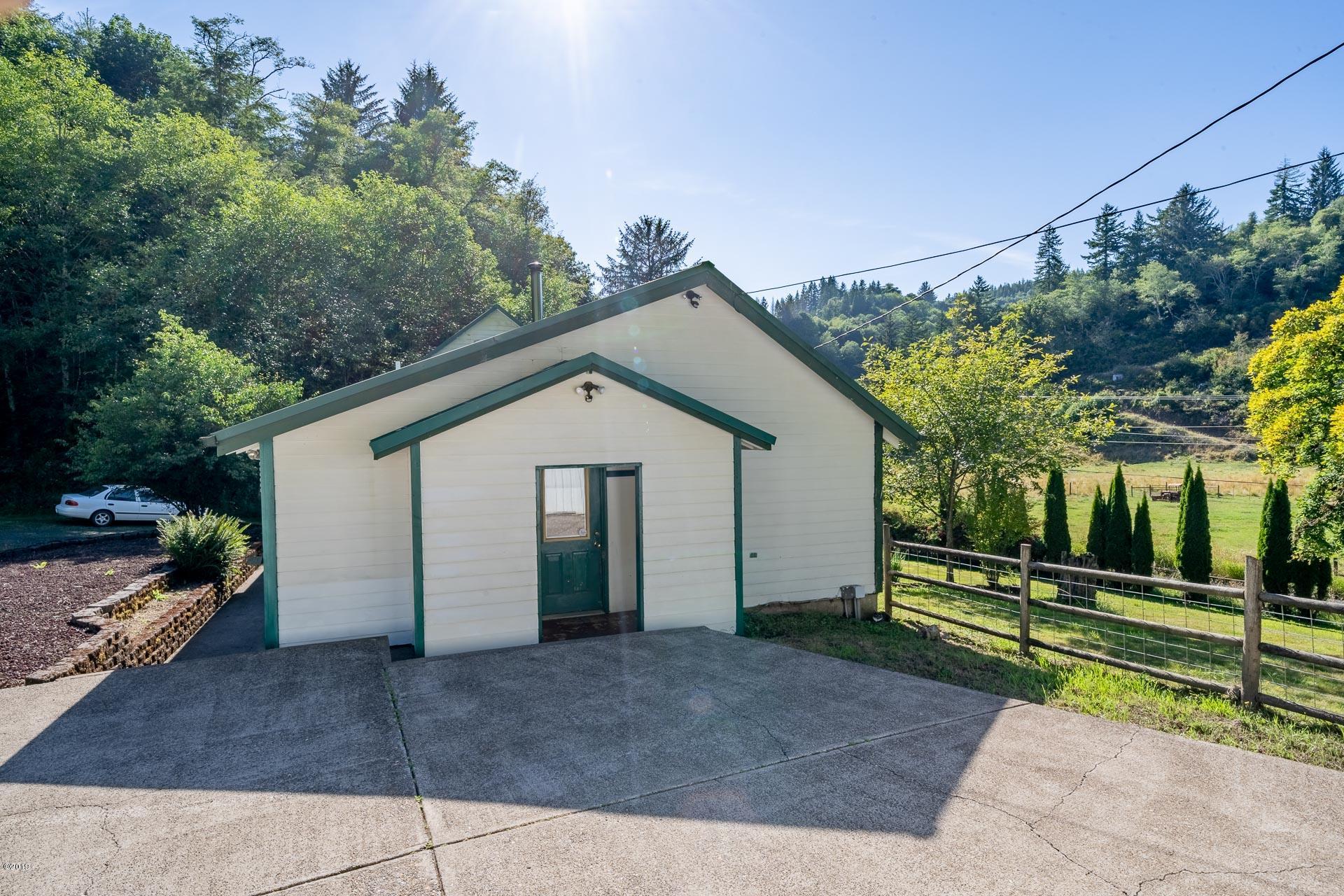 429 Hidden Valley Road Toledo, OR 97391 - Photo 23 of 41 REAR OF HOME OFF MASTER BEDROOM