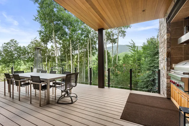 a view of a patio on wooden deck and patio