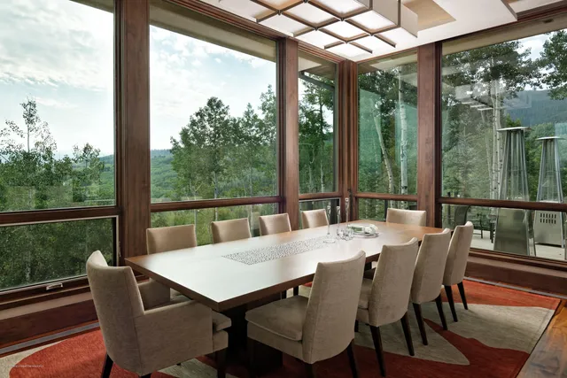 a view of a patio with a table chairs and a table