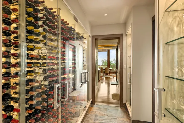 a bathroom with a shower and a glass door