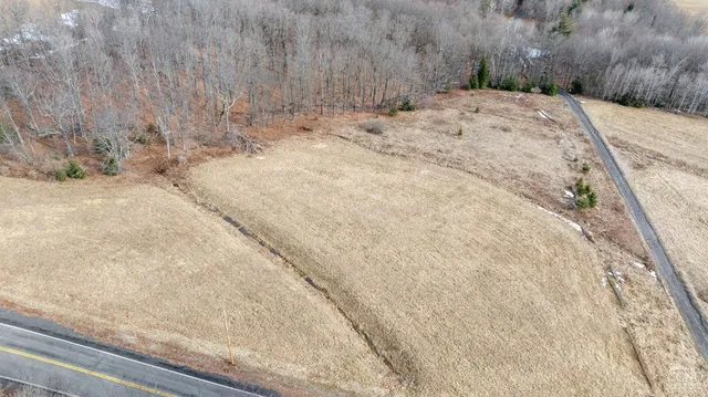 a view of a backyard of the house