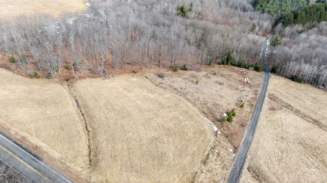 a view of a backyard of the house