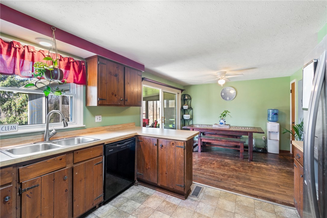 497 Hartnagle Road Arcadia, NY 14513 - Photo 11 of 49 The kitchen view to the seating area - looks out o