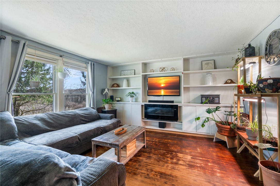497 Hartnagle Road Arcadia, NY 14513 - Photo 16 of 49 The living room - right off the kitchen!