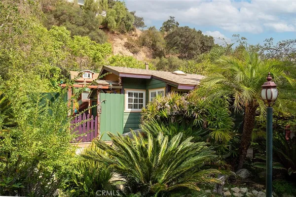 a view of a house with a tree