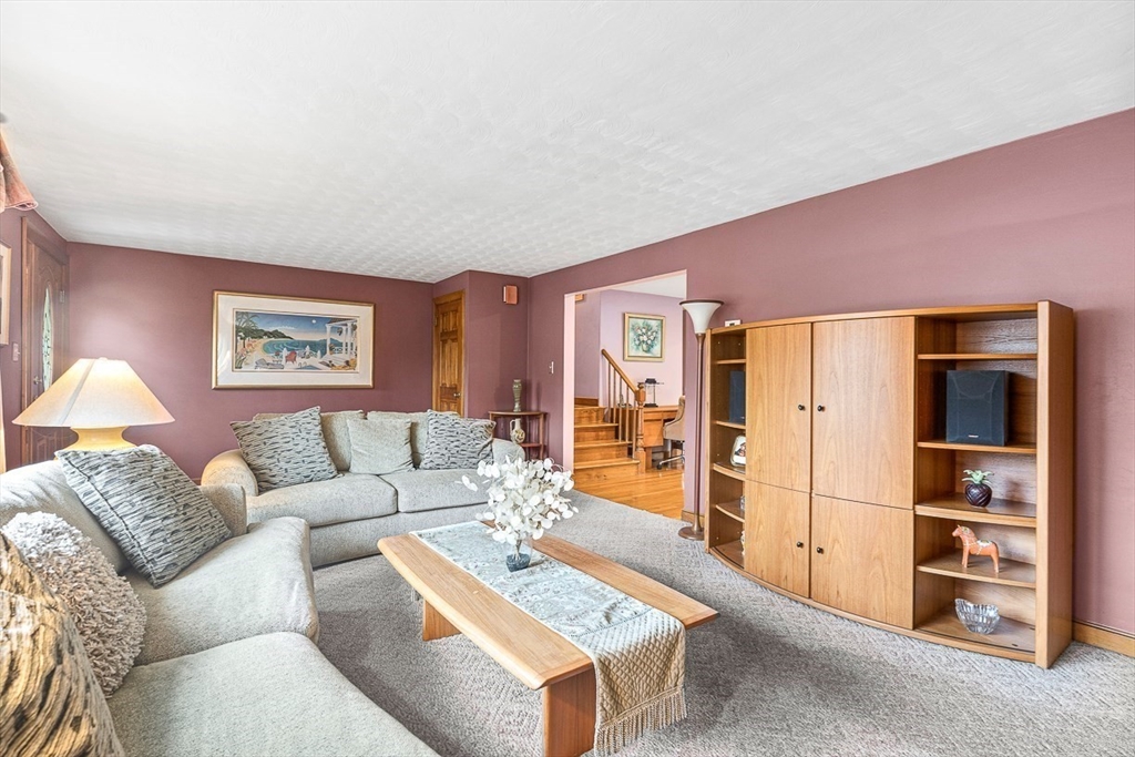 121 Pine Ridge Road Medford, MA 02155 - Photo 3 of 37 a living room with furniture a refrigerator and a stove
