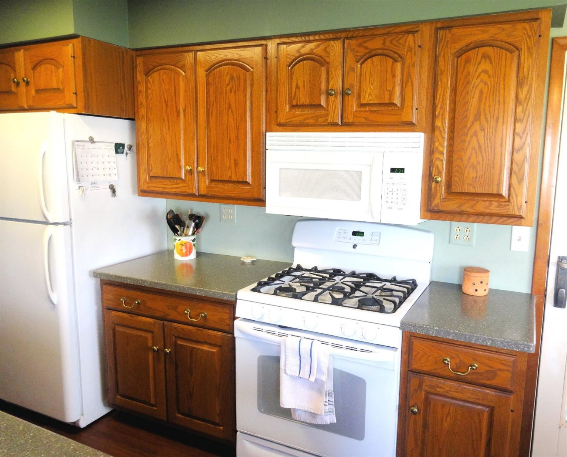 3 Harrison Boulevard Valparaiso, IN 46383 - Photo 10 of 10 a kitchen with granite countertop cabinets and black appliances