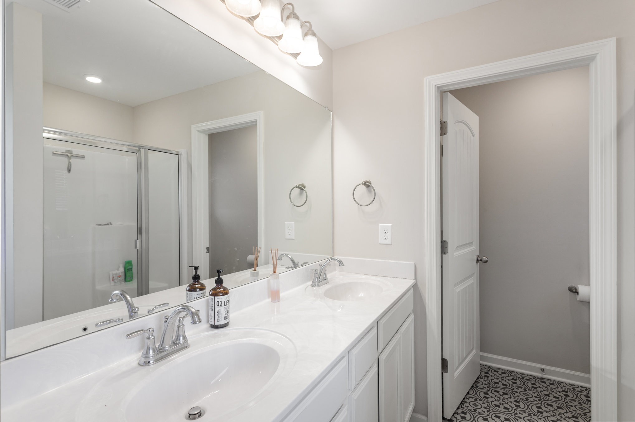809 Callie Lane Pleasant View, TN 37146 - Photo 20 of 30 a bathroom with double vanity sink and a mirror