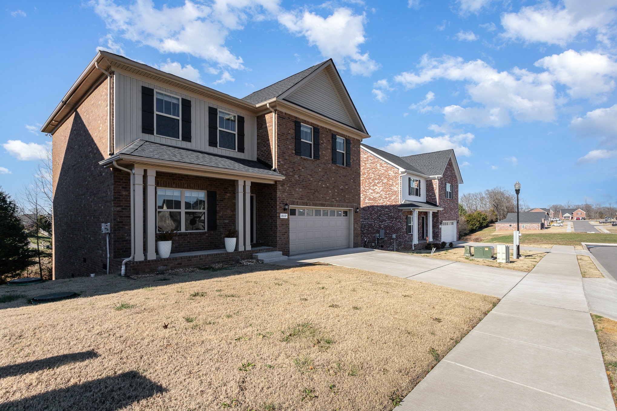 809 Callie Lane Pleasant View, TN 37146 - Photo 2 of 30 a front view of a house with a yard