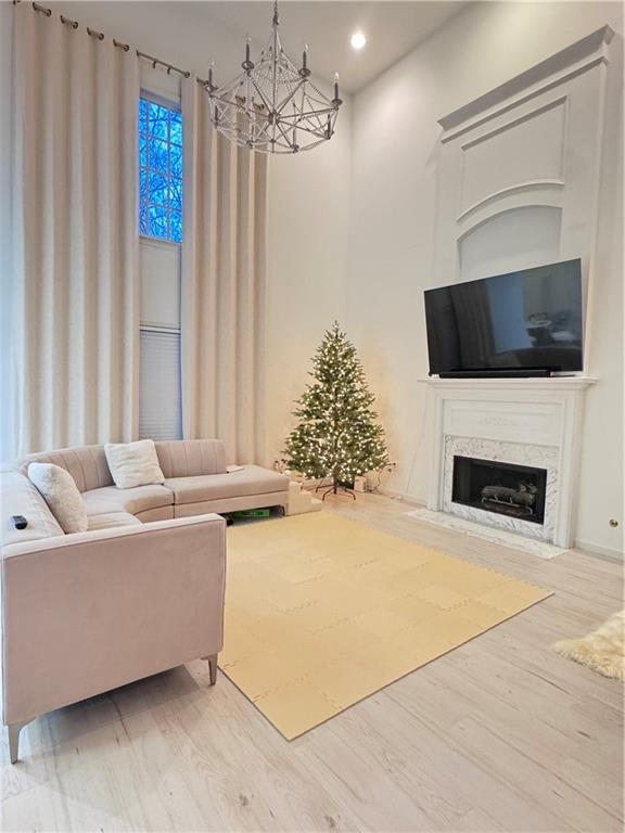 320 Morning Mist Walk Suwanee, GA 30024 - Photo 1 of 19 a living room with furniture a flat screen tv and a fireplace