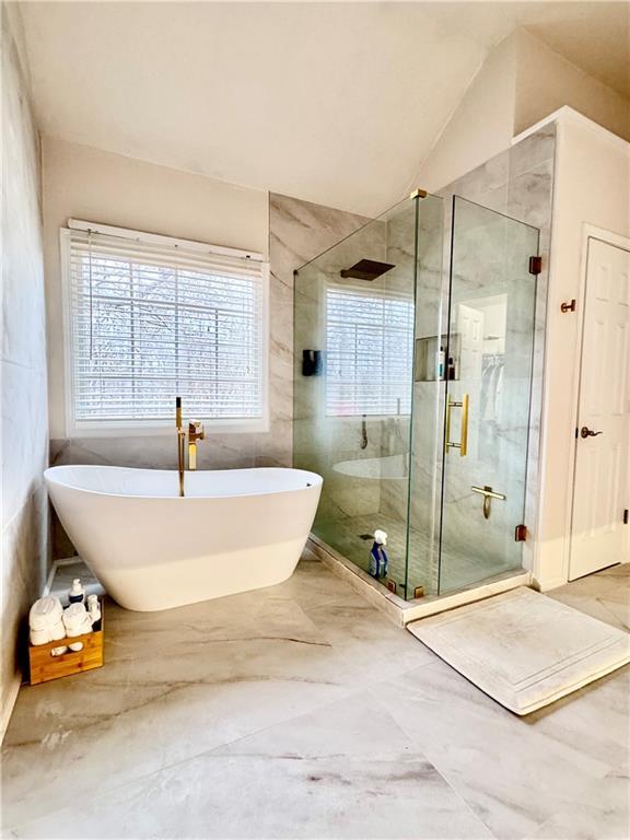 320 Morning Mist Walk Suwanee, GA 30024 - Photo 14 of 19 a bathroom with a tub and shower