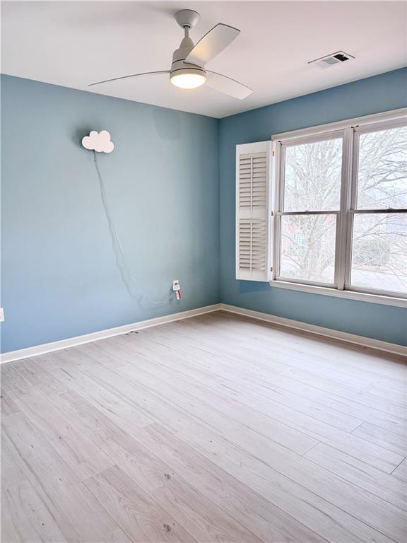 320 Morning Mist Walk Suwanee, GA 30024 - Photo 15 of 19 an empty room with wooden floor and windows