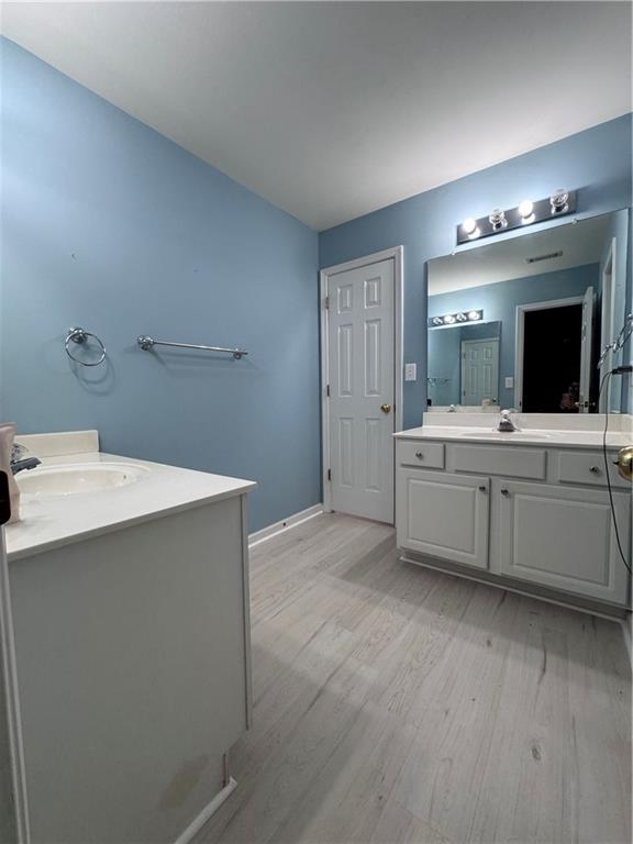 320 Morning Mist Walk Suwanee, GA 30024 - Photo 17 of 19 a bathroom with a sink and a mirror