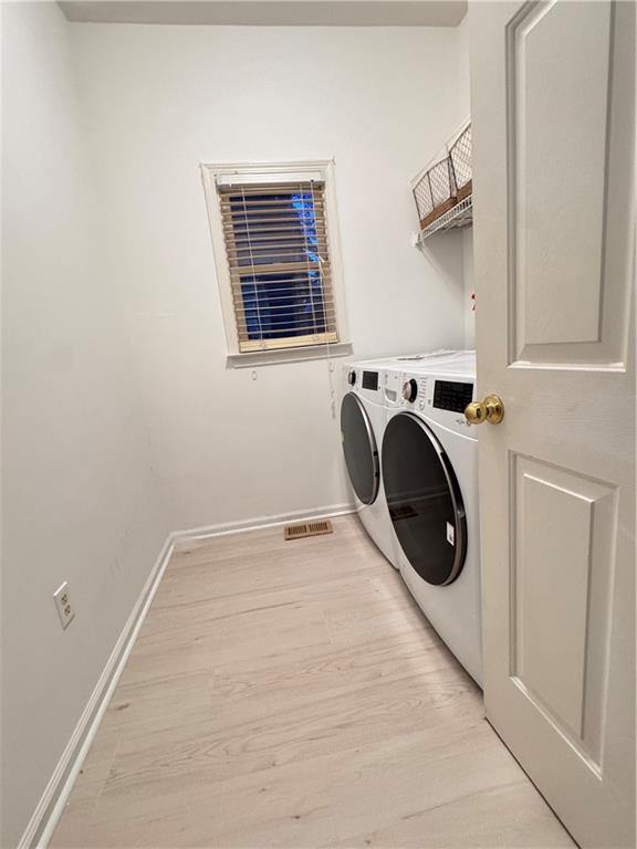 320 Morning Mist Walk Suwanee, GA 30024 - Photo 18 of 19 a utility room with dryer and washer