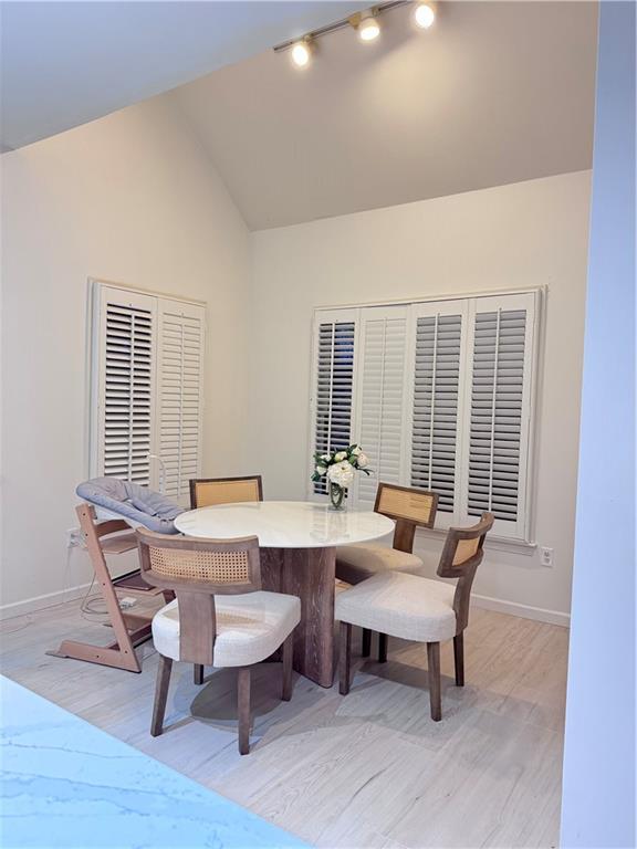320 Morning Mist Walk Suwanee, GA 30024 - Photo 7 of 19 a view of a dining room with furniture window and wooden floor