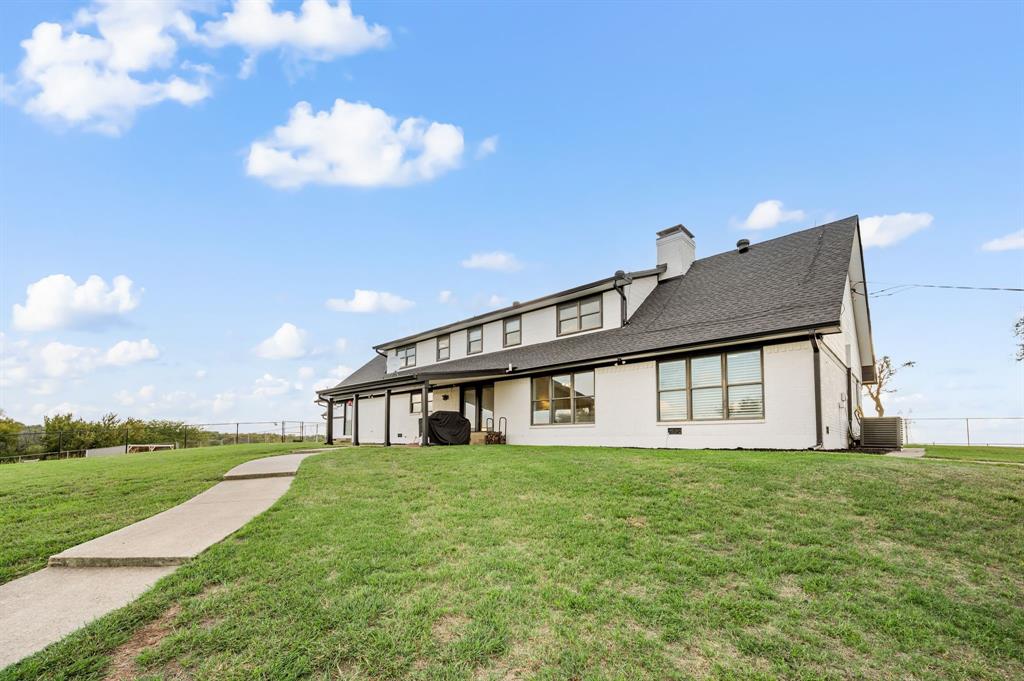 10902 Clear Creek Road West Sanger, TX 76266 - Photo 21 of 40 a house view with a garden space