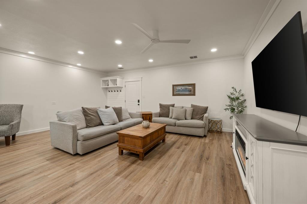 10902 Clear Creek Road West Sanger, TX 76266 - Photo 26 of 40 a living room with furniture and a flat screen tv