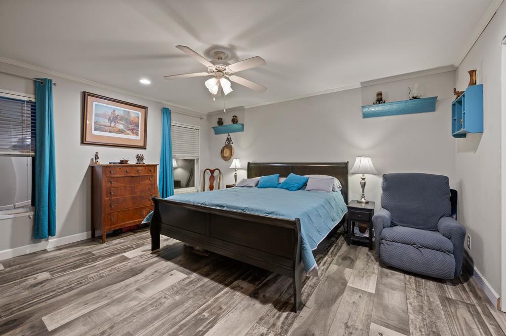 10902 Clear Creek Road West Sanger, TX 76266 - Photo 30 of 40 2nd House Bedroom featuring ornamental molding, light wood-style flooring, ceiling fan, and recessed lighting