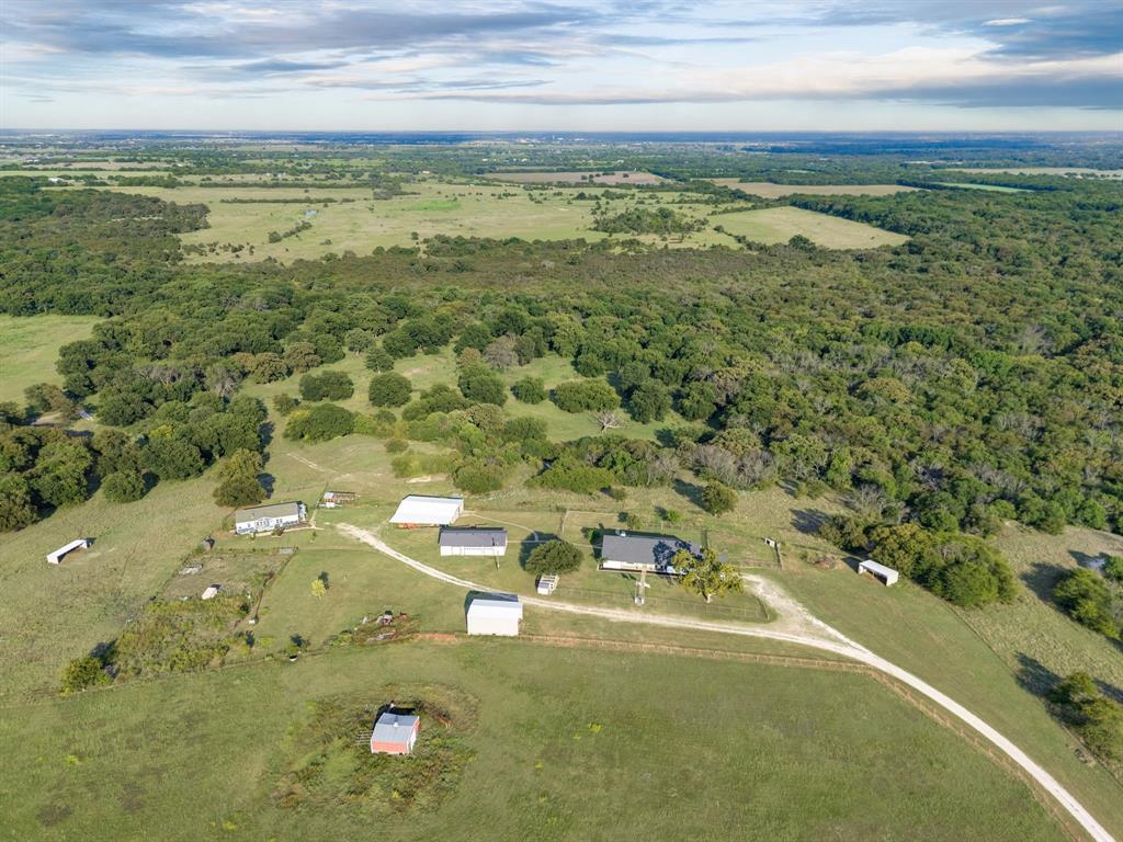 10902 Clear Creek Road West Sanger, TX 76266 - Photo 37 of 40 Aerial view of property's location featuring a heavily wooded area