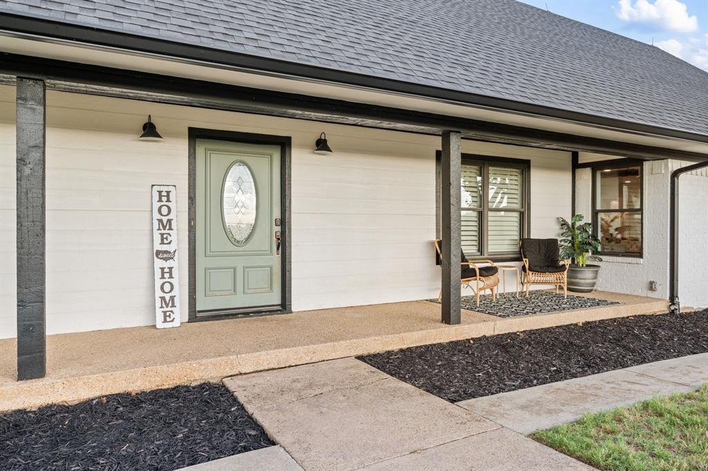 10902 Clear Creek Road West Sanger, TX 76266 - Photo 4 of 40 Property entrance with a shingled roof and covered porch